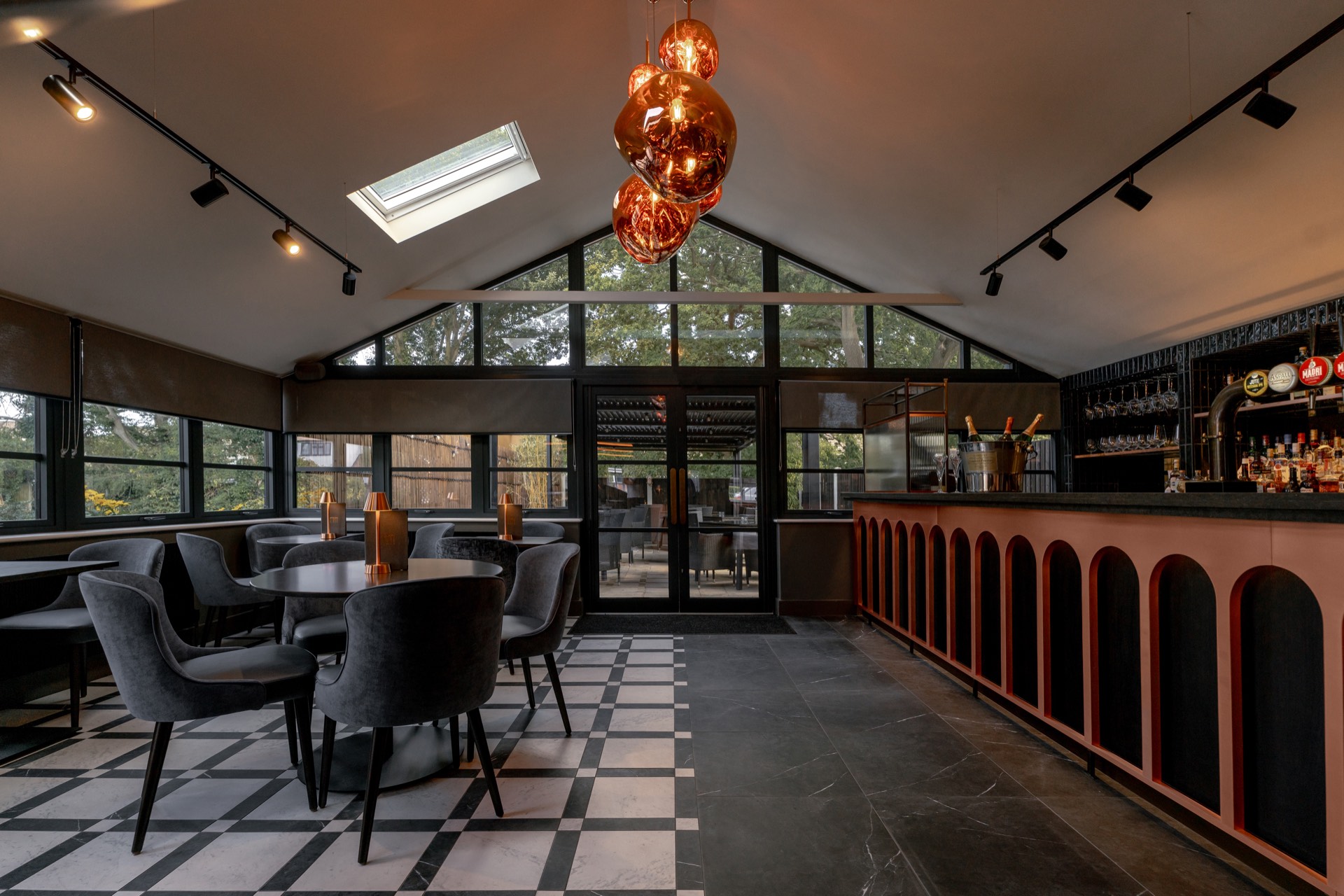 The bar at Mason's beneath its copper pendant lights