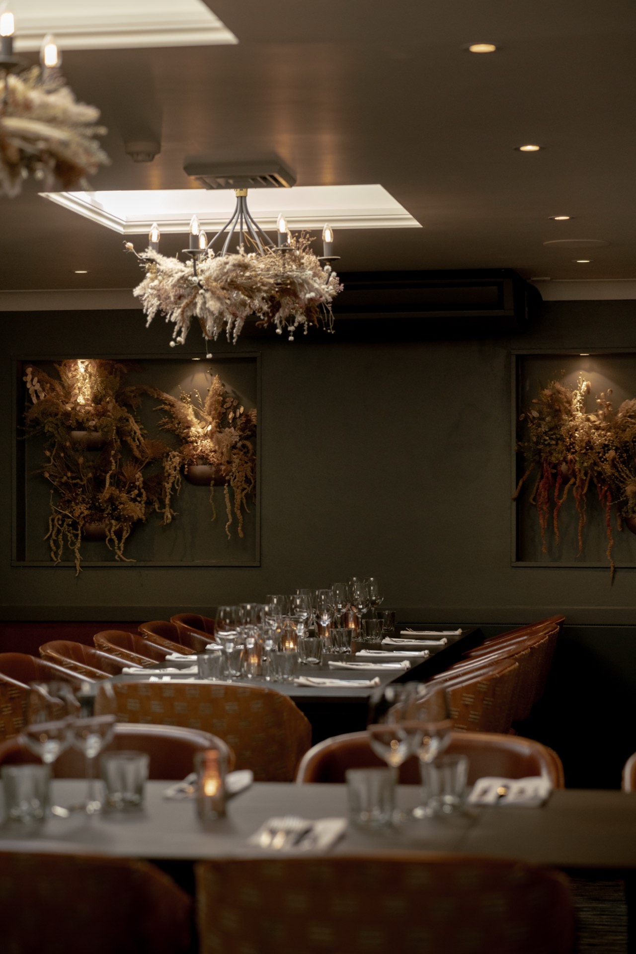 The private dining room at Mason's, its long table set beneath the chandelier